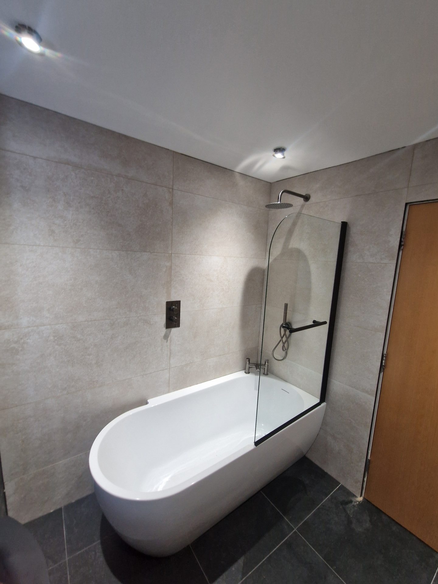 Modern bathroom with a freestanding bathtub and shower